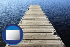 colorado map icon and a boat dock on a blue water lake