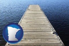 minnesota map icon and a boat dock on a blue water lake