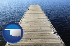 oklahoma map icon and a boat dock on a blue water lake