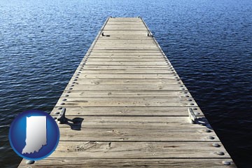 a boat dock on a blue water lake - with Indiana icon